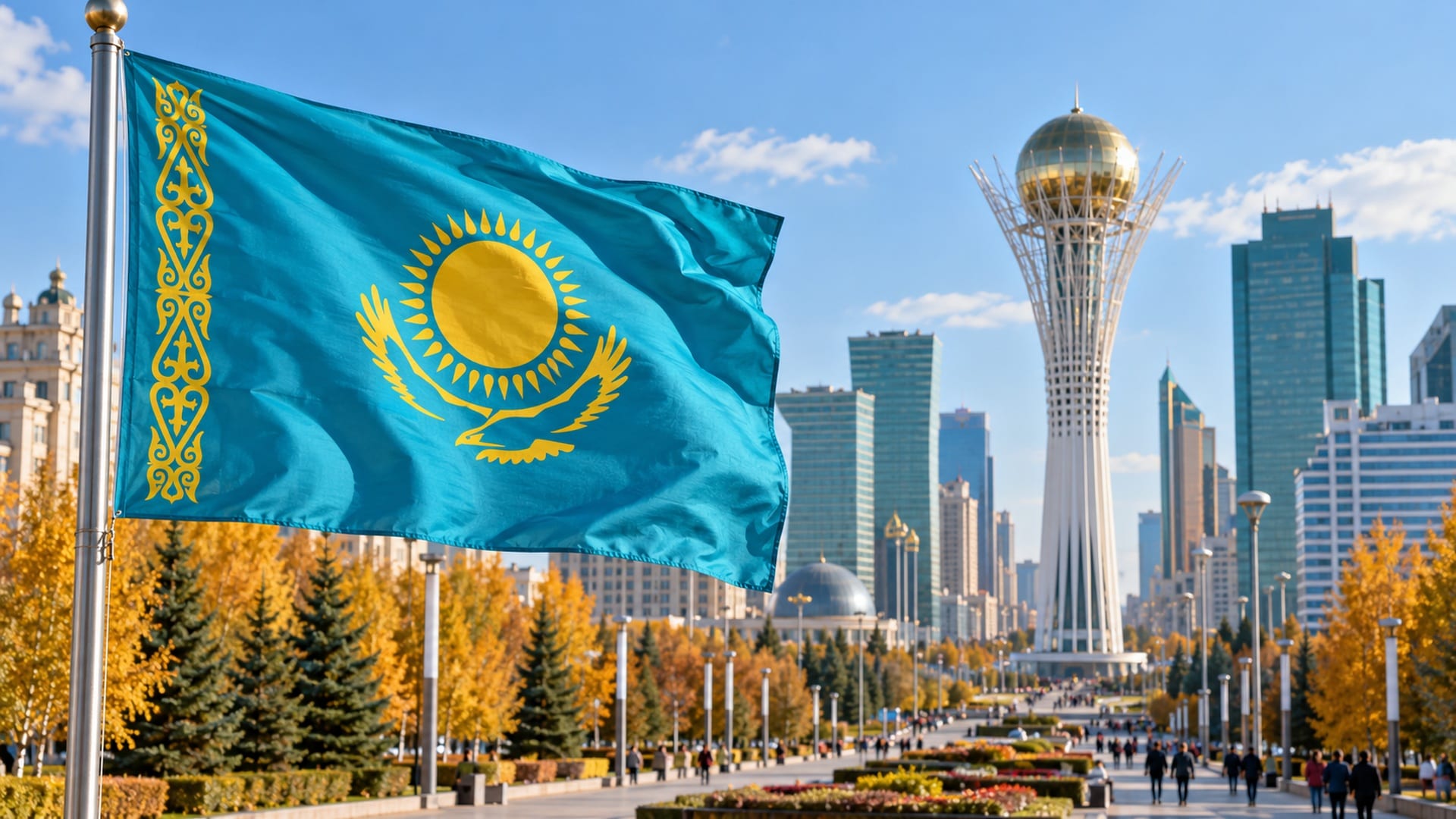 Флаг Казахстана на фоне монумента Байтерек и осенней Астаны.